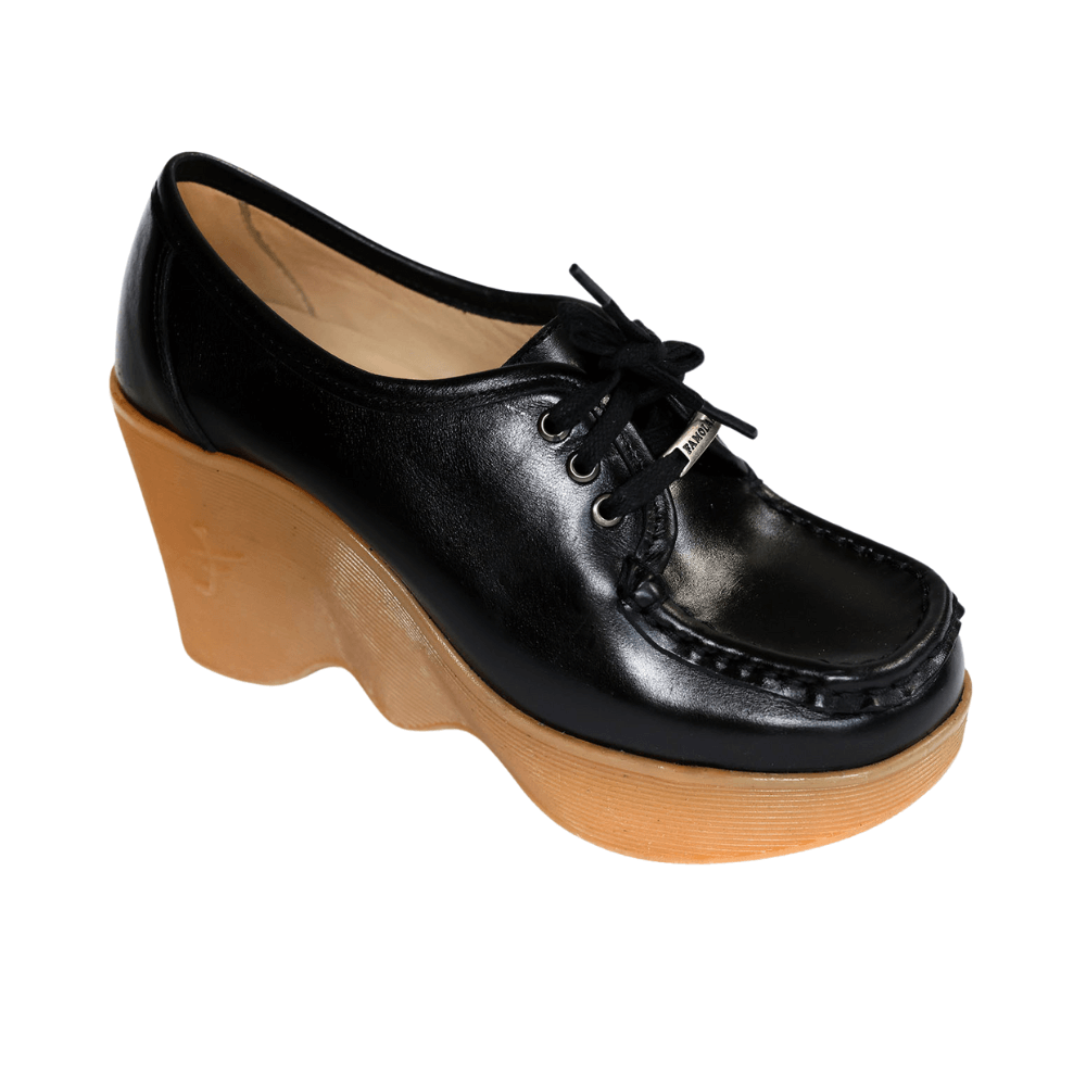 A high wedge that walks like a low one Squarer footbed is comfortable for long walks Hand sewn leather upper Leather lined all the way to your toes