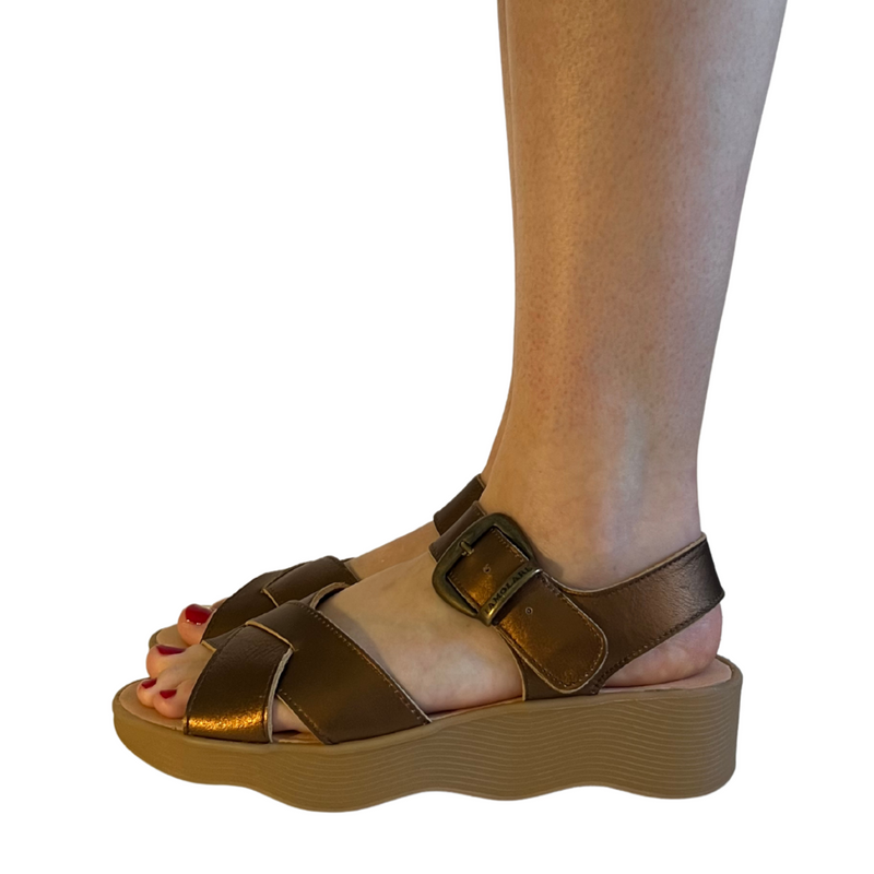 Famolare Betsy Cross Copper leather sandals featuring crossover straps, an adjustable ankle buckle, and the signature recycled rubber wave sole.