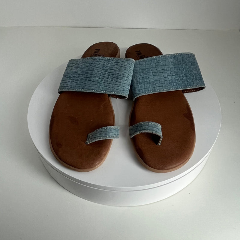 Famolare Band and Deliver sandal with a classic wedge silhouette, leather straps, and recycled rubber wave sole.