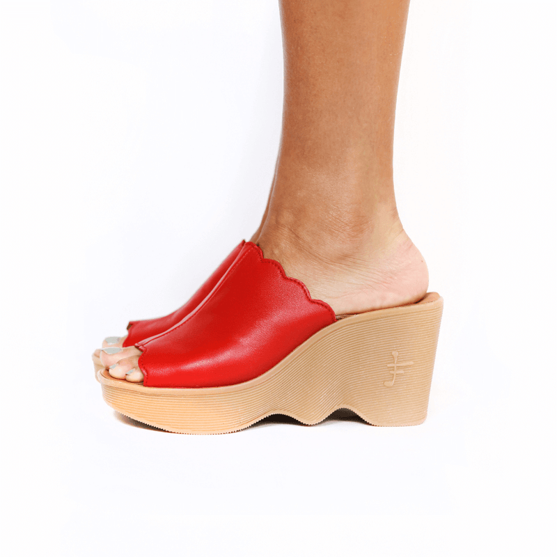 Famolare Upslide Blood platform slide sandal featuring deep red leather straps and the signature recycled rubber wave sole.